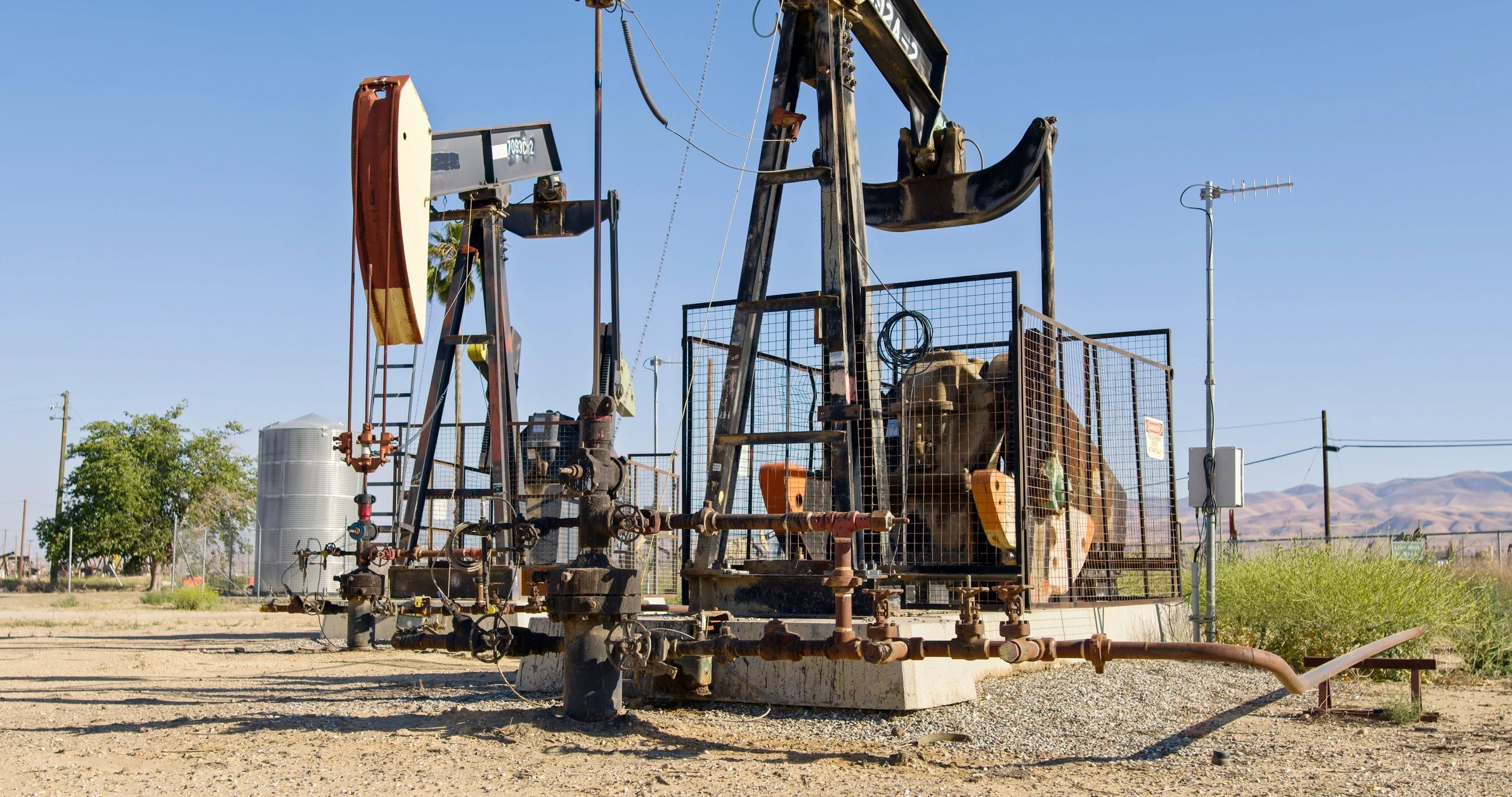 Oil pump jack in active inland field