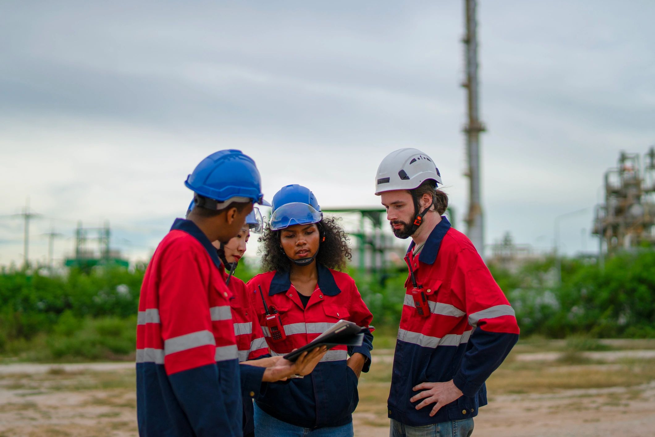 Industrial field workers collaborating on site