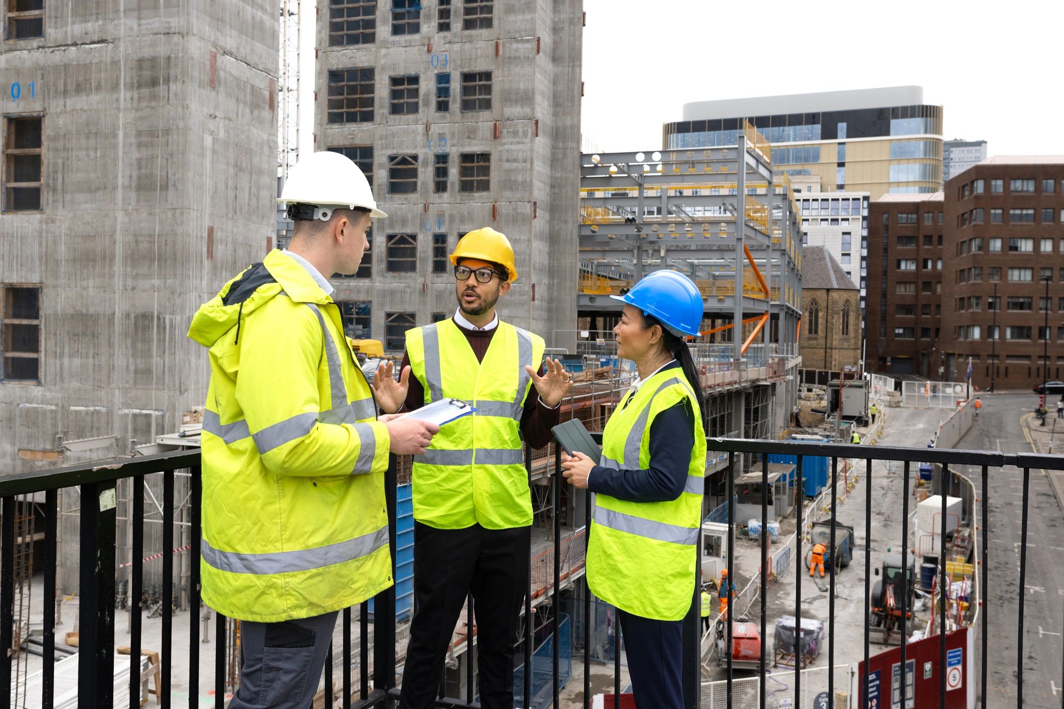 Technical team reviewing plans at an industrial worksite