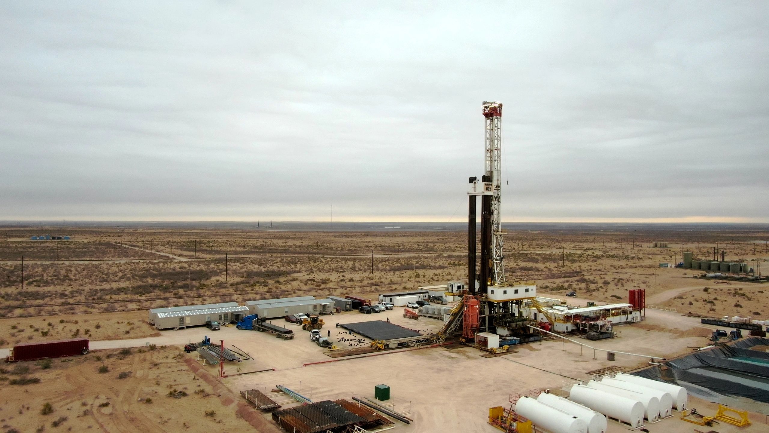 Onshore drilling operation with rig and support equipment